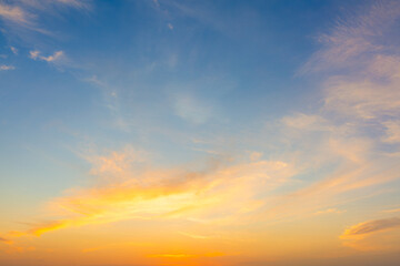 Obraz premium Clouds and orange sky in the morning background,Dusk,Pink and red sunlight and Dramatic storm clouds on Twilight sky, Landscape horizon Golden sky nature Summer Background , Sunset Sky.