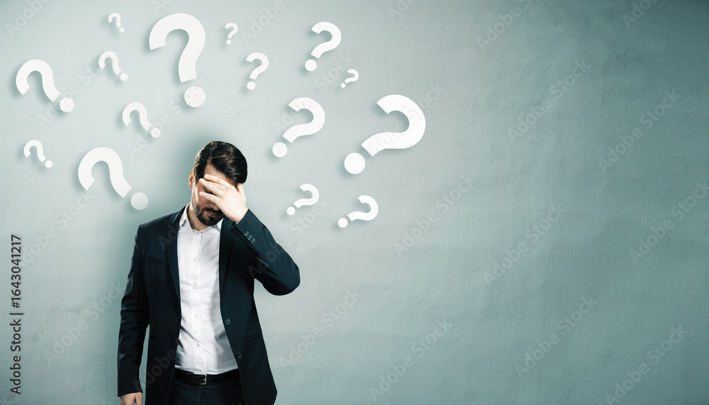 Poster confused businessman with hand on face surrounded by floating question marks on light abstract wall 