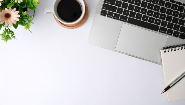 White desk with laptop, blank notepad, flower, coffee cup, and pen flat lay on white background with copy space, perfect for workspace design, productivity concepts, business presentations