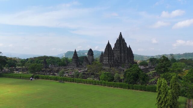 Aerial: Prambanan 9th-century Hindu temple compound during the day in the Special Region of Yogyakarta, in southern Java, Indonesia, establishing drone shot