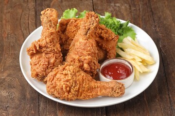Crispy fried chicken is a dish made from pieces of chicken that have been coated with flour or a thin batter that is seasoned and fried, deep-fried, fried in a pressure fryer, or air-fried.