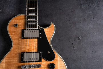 Fototapeta premium Electric guitar with natural pattern isolated on black background.