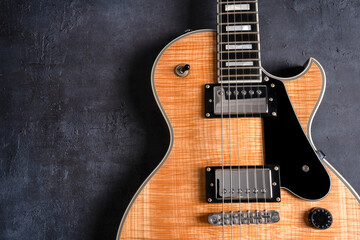 Fototapeta premium Electric guitar with natural pattern isolated on black background.