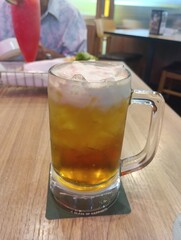 butter beer cocktail with whipped cream close up 