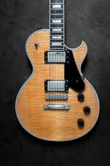 Fototapeta premium Electric guitar with natural pattern isolated on black background.