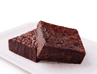Delicious homemade brownies served on a white plate with a clean background