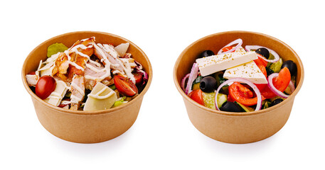 Fresh salads with chicken and vegetables in takeout bowls