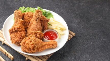 Crispy fried chicken is a dish made from pieces of chicken that have been coated with flour or a thin batter that is seasoned and fried, deep-fried, fried in a pressure fryer, or air-fried.