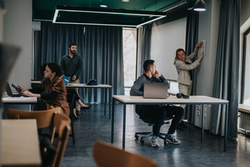 Business professionals working together on projects in a well-lit and modern office environment....