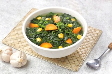 Sayur bayam bening or spinach clear soup in bowl