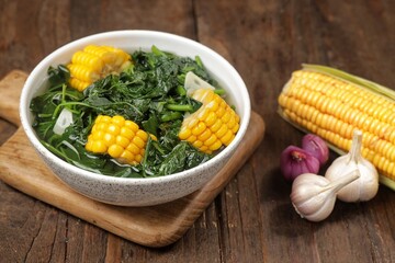 Sayur bayam bening or spinach clear soup in bowl