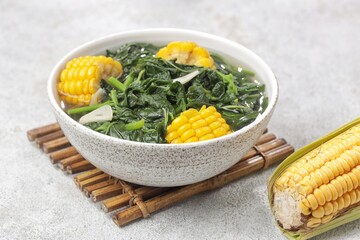 Sayur bayam bening or spinach clear soup in bowl