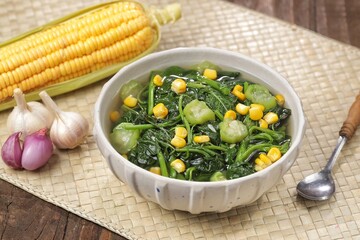 Sayur bayam bening or spinach clear soup in bowl