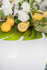 fresh lemons on green leaf surface