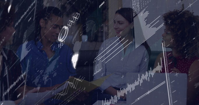 Team of professionals reviewing printed reports on laptop in office lounge projecting data overlay