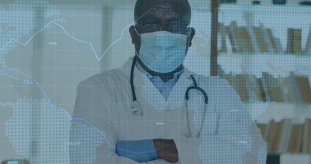Standing physician wearing lab coat, mask and eyeglasses in office, with stethoscope and shelves