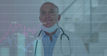 Analyzing data overlay senior doctor standing in clinic hallway, wearing stethoscope, surgical mask
