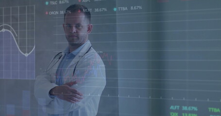 Standing doctor wearing lab coat, stethoscope at lab display showing graphs and charts, copy space