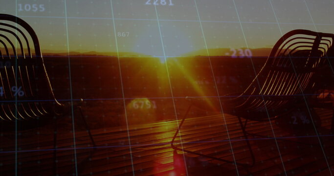 Naklejki Revealing glowing sun disk over rooftop deck at dusk, featuring wireframe chairs with numeric grid