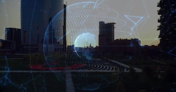 Glowing holographic digital network globe overlay hovering in urban park, with skyscraper backdrop - Powered by Adobe