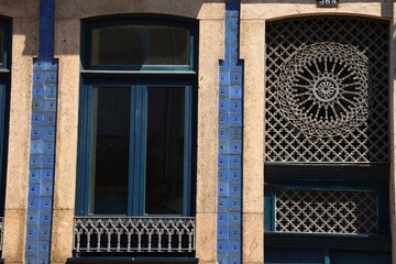 Facade of historical house in Porto, Portugal, with signature historical doors of Porto buildings.