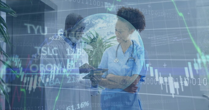 Healthcare team examining digital tablet in clinic corridor, with stethoscope and chart overlay