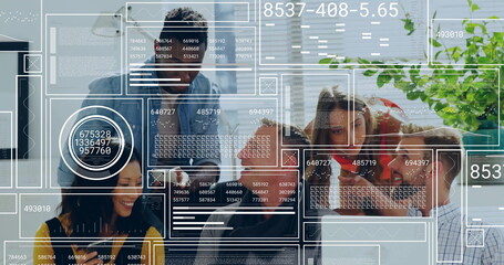 Collaborating five professionals discussing AR panels in conference room, with laptops and tablets