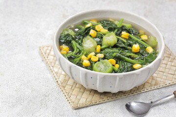 Sayur bayam bening or spinach clear soup in bowl