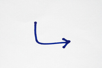 hand drawn arrow with blue marker pen on white background