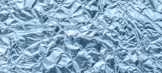 Shiny metallic blue foil crumpled texture background