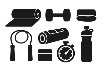 Fitness equipment arranged on a plain background showcasing exercise essentials for a workout session at home