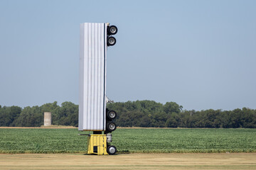 Truck parked on pole in field