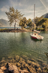 Boat on the shore of Lake Garda, Italy. Toned.