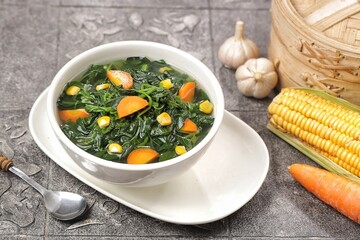 Sayur bayam bening or spinach clear soup in bowl