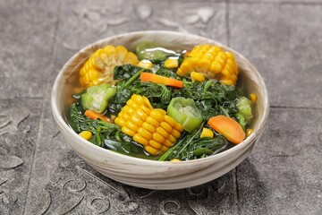 Sayur bayam bening or spinach clear soup in bowl