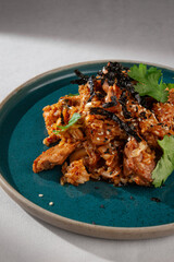 Spicy Korean style kimchi fried rice with chicken, shredded seaweed, sesame seeds and cilantro...