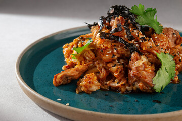 Spicy Korean style kimchi fried rice with chicken, shredded seaweed, sesame seeds and cilantro...