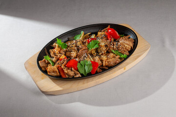 Traditional Korean style grilled pork with bell peppers, onions, sesame seeds and fresh cilantro...