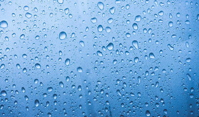 Closeup of Water Droplets on a Light Blue Surface