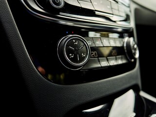 Car's climate control system is shown with the temperature set at 20 degrees