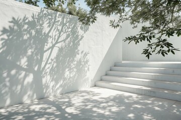 Sunlight and shadows dance on a modern white outdoor staircase and wall