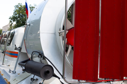 The rear part of the hovercraft rescue boat with large propeller screw for gaining speed and guides for turning. The fan on rear part of the boat as element for gaining speed. Unusual transport