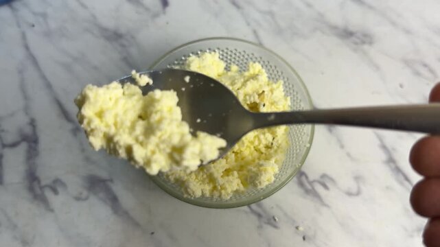 colostrum in spoon closeup