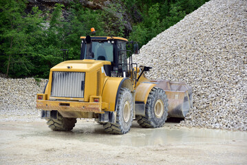 Wheel loader excavator unloading sand