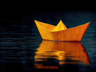 Fototapeta premium Orange paper boat on dark water