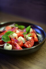 Tomato salad with basil, red onion and croutons