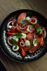 Tomato salad with basil, red onion and croutons