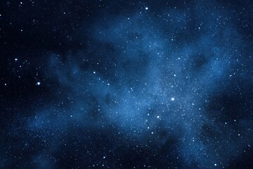 Obraz premium Starry night sky filled with countless white specks against a deep blue background showcasing the beauty of the cosmos