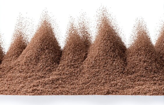 Brown powder mounds against white background