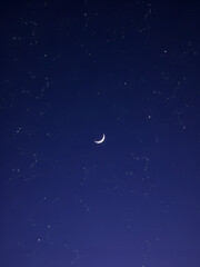 Fototapeta premium Celestial Symphony: An Ethereal Night Sky with Constellations and Crescent Moon
